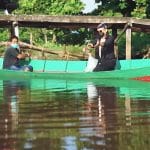 Wali Kota Pontianak, Edi Rusdi Kamtono saat menebar benih indukan ikan nila di parit Sungai Jawi Pontianak