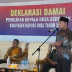 Wakil Bupati Kapuas Hulu, Wahyudi Hidayat memberikan sambutan dalam acara "Deklarasi Damai Pemilihan Kepala Desa Serentak Tahun 2022" di Aula Bappeda. Kamis (21/07/2022). (Foto: Istimewa)