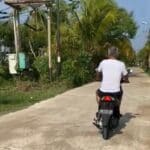 Bupati Ketapang, Martin Rantan berkendara sendirian dengan sepeda motor keliling komplek. (Foto: Adi LC)